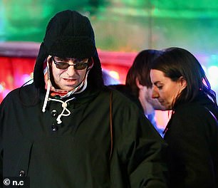 Wrapped up: Liam had several layers on to keep warm