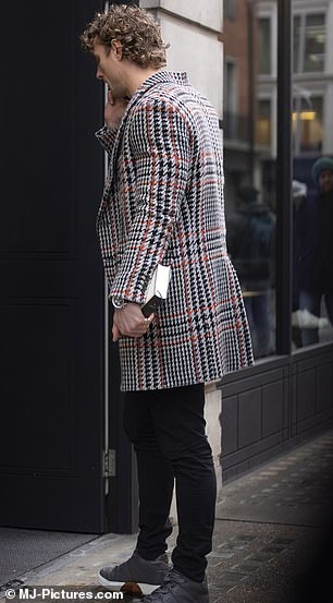 Casually-clad: Jack rocked grey trainers and black troers