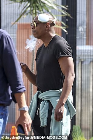 Chappelle is pictured here to black out from his cigarette