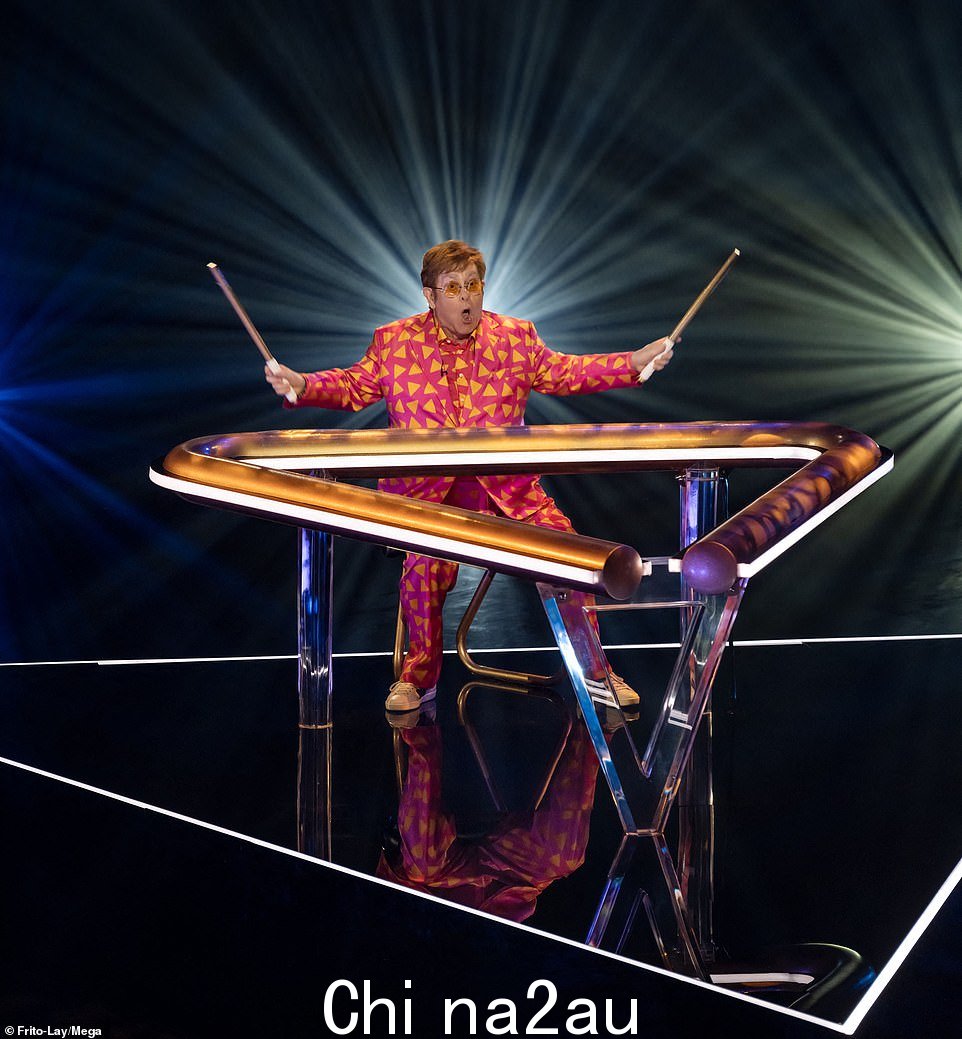 Cameo: Sir Elton John, 75, swapped the piano for the triangle in the new Super Bowl Doritos advert as he made blink-and-you¿ll-miss-it appearance alongside Jack Harlow and Missy Elliot