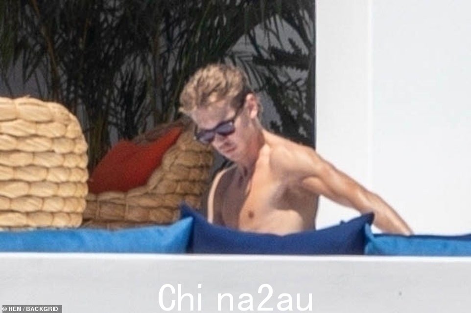 Looking good! After arriving to the pool, Gerber slipped into a skimpy thong bikini while her hunky beau opted to display his very muscular physique in just a pair of black swim trunks