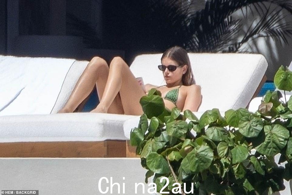Relaxed: On their way to take dip, he was seen driving them in a golf cart as the American Horror Story actress, 21, rested her head on his shoulder while rocking a green and white striped shirt and long floral skirt