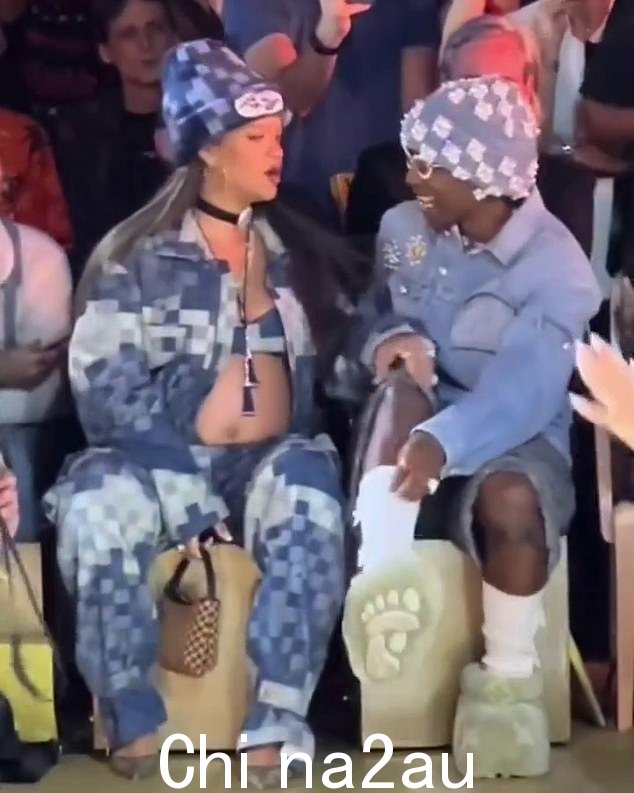 潮流引领者:Rihanna 穿着露脐上衣、牛仔裤和超大号衬衫,均采用 Pharrell 为即将推出的系列设计的“damoflage 印花”