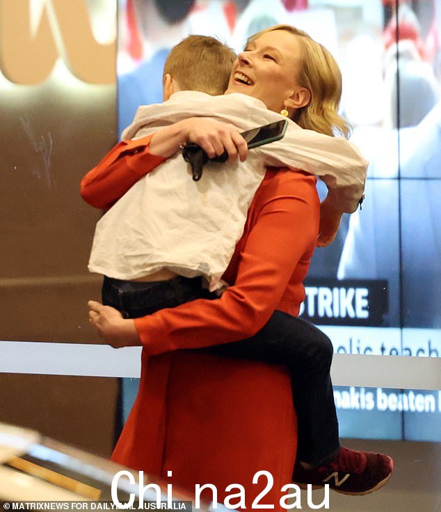 Sales (pictured with one of her children) said she left the 7:30 Report to spend time with her two young sons, James and Daniel