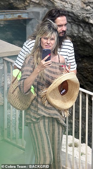 Stylish: Heidi topped her look off with a straw hat
