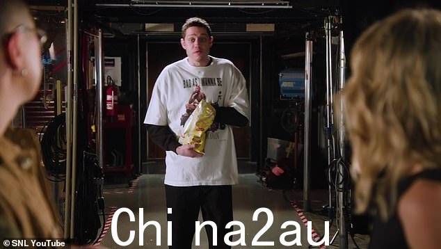 Surprise: Suddenly, Pete appears in the studio while snacking on a bag of salty potato chips. 'Yo!' he casually called out to the comedians, who whirled around in shock to see Davidson