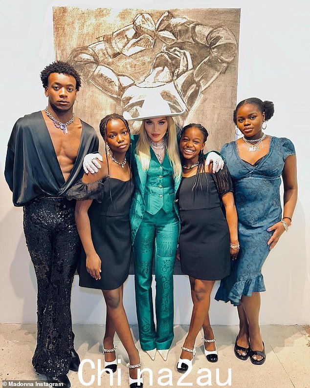 When she poses with others, like her kids, it is noticeable how petite this Material Girl is