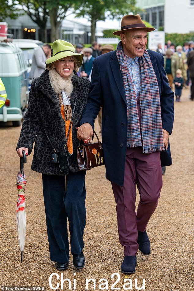 Vinnie Jones looked happy as he arrived at the 27th Goodwood Revival hand in hand with girlfriend Emma Ford in West Sussex on Sunday