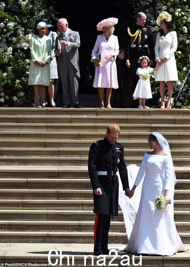 Harry and Meghan exit St George's Chapel in Windsor Castle after their royal wedding ceremony with their family behind them