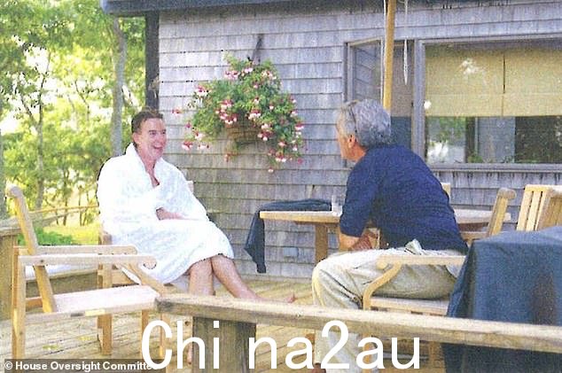 Pictured: Lord Mandelson (left) in a fluffy white dressing gown enjoying a chat with Epstein (right)