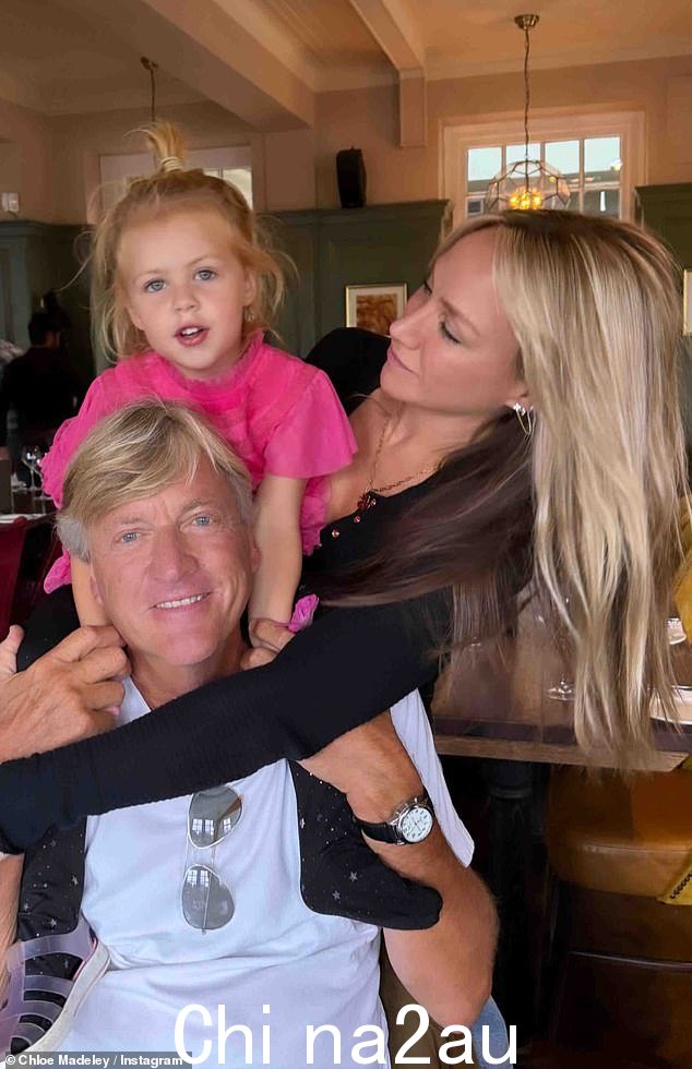Fitness influencer Chloe cut a casual figure in a long sleeved black top as she later put her little girl on her dad Richard Madeley's shoulders while enjoying lunch with her parents
